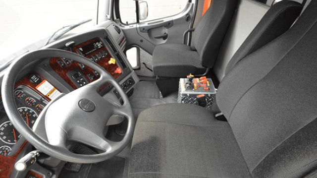 Photo of the Inside of a Freightliner 114SD Truck