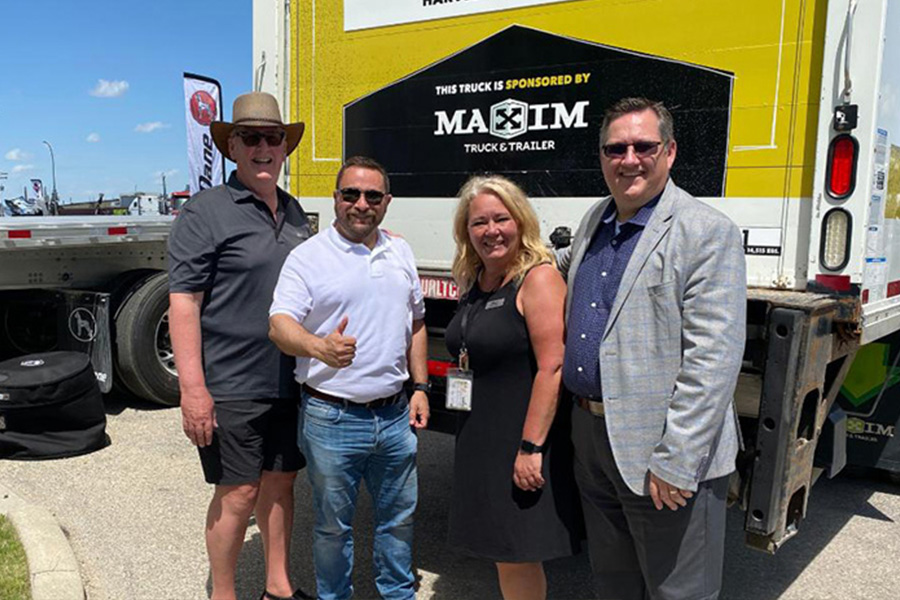 people standing in front of a truck